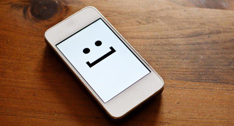 Quel est le symbole d'un visage souriant lors d'un texto ?